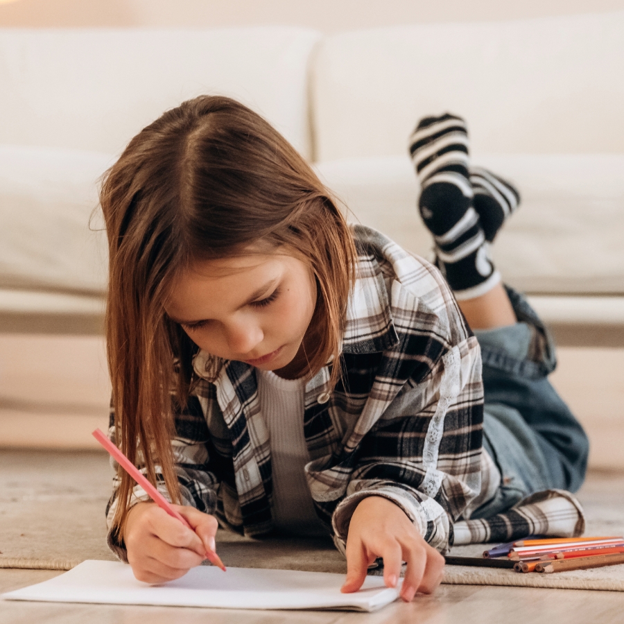 real-connection image Child drawing on floor